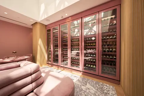 wine cabinets running the length of the lounge past a curved banquette