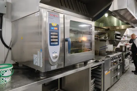 combi oven and range under an exhaust canopy
