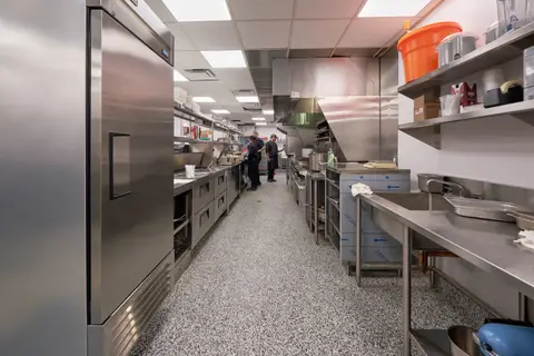 service aisle between reach-in refrigeration and the prep line