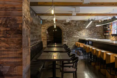 bar counter seen through a stone archway
