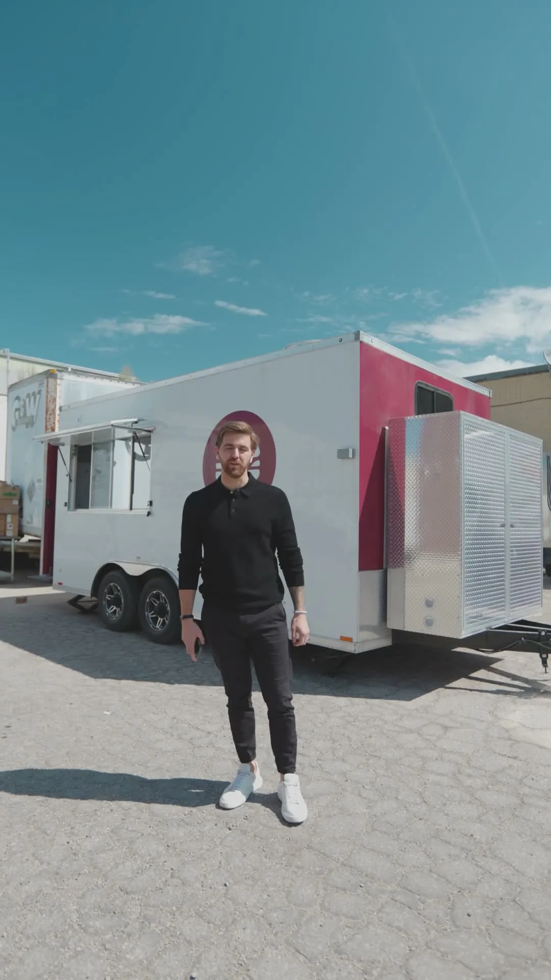 The Burger Drops concession trailer built by The Cesario Group, a white and magenta trailer outfitted as a mobile commercial kitchen