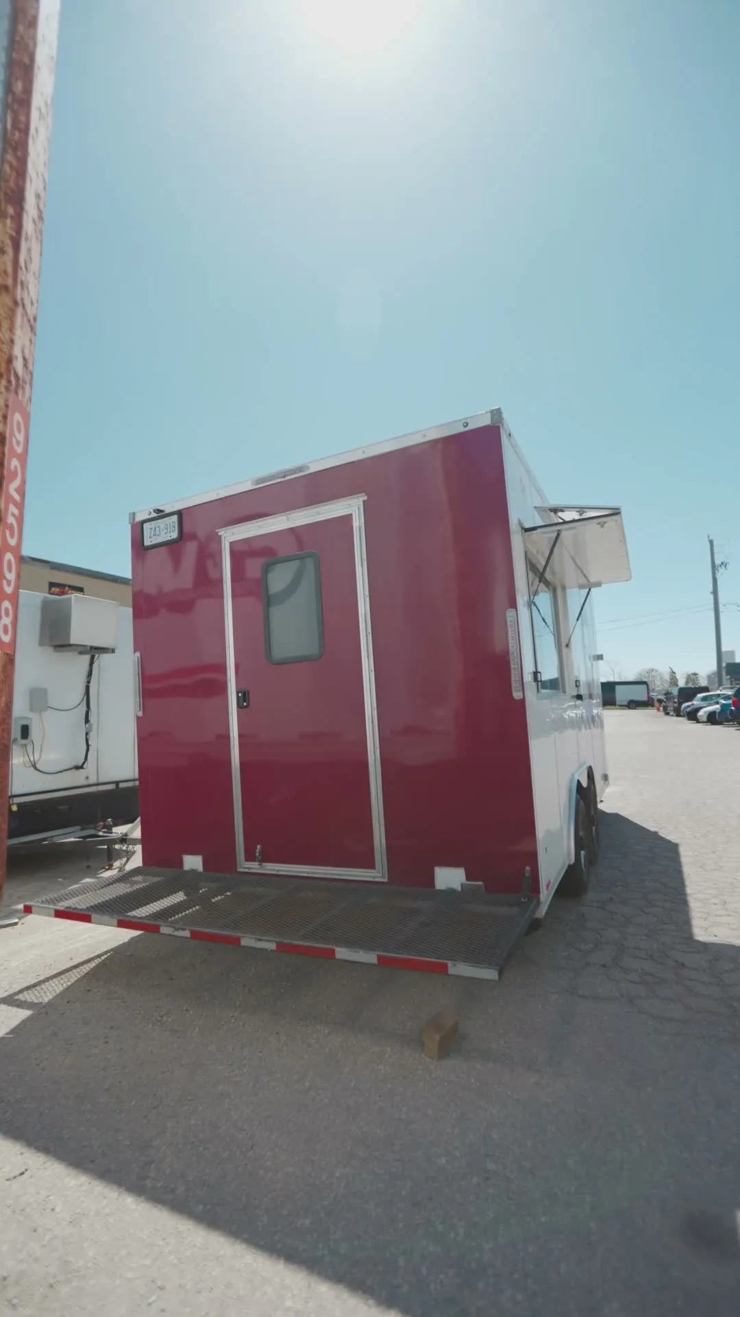 The rear of the finished Burger Drops trailer with the fold-down service deck, built by The Cesario Group