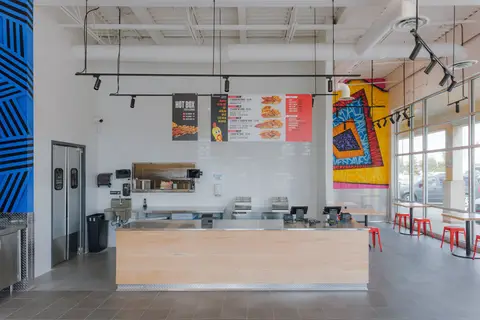 order counter and overhead menu boards at Dave's Hot Chicken Burlington