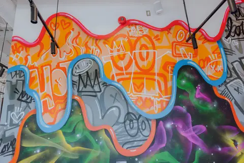 painted mural wall above diamond plate wainscot