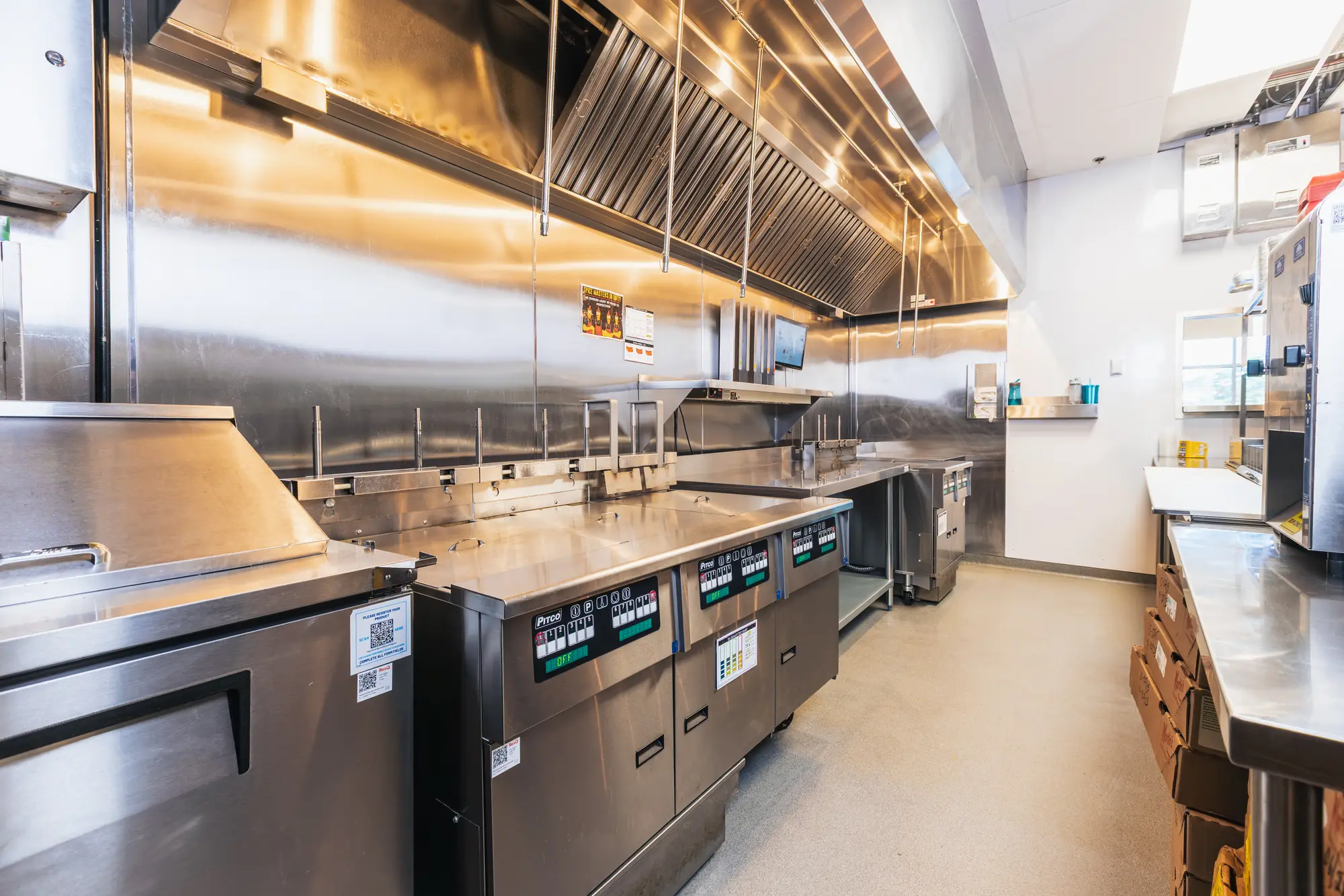 Commercial cook line and ventilation hood at Dave's Hot Chicken Pickering