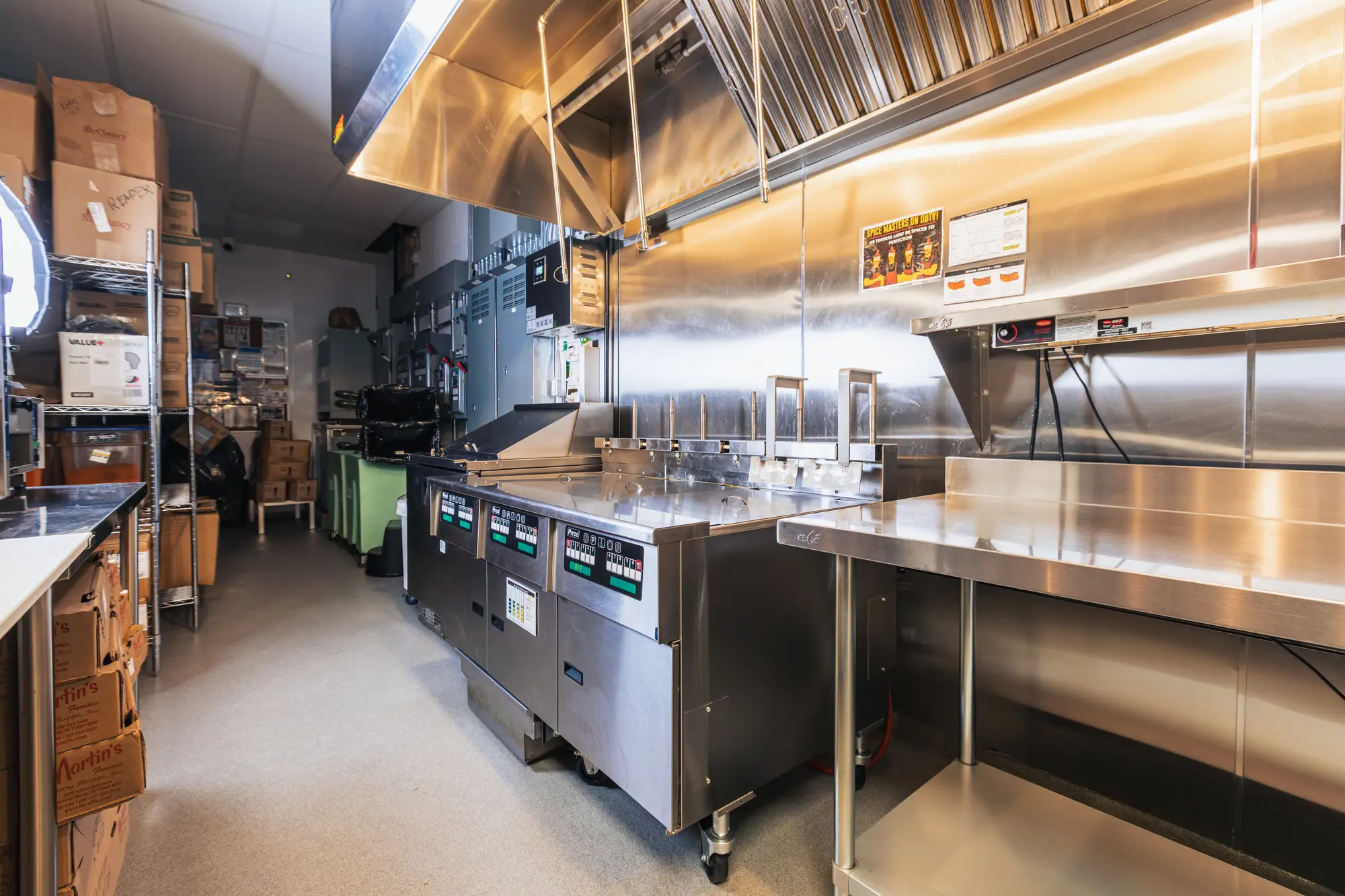 Stainless prep tables and shelving at Dave's Hot Chicken Pickering
