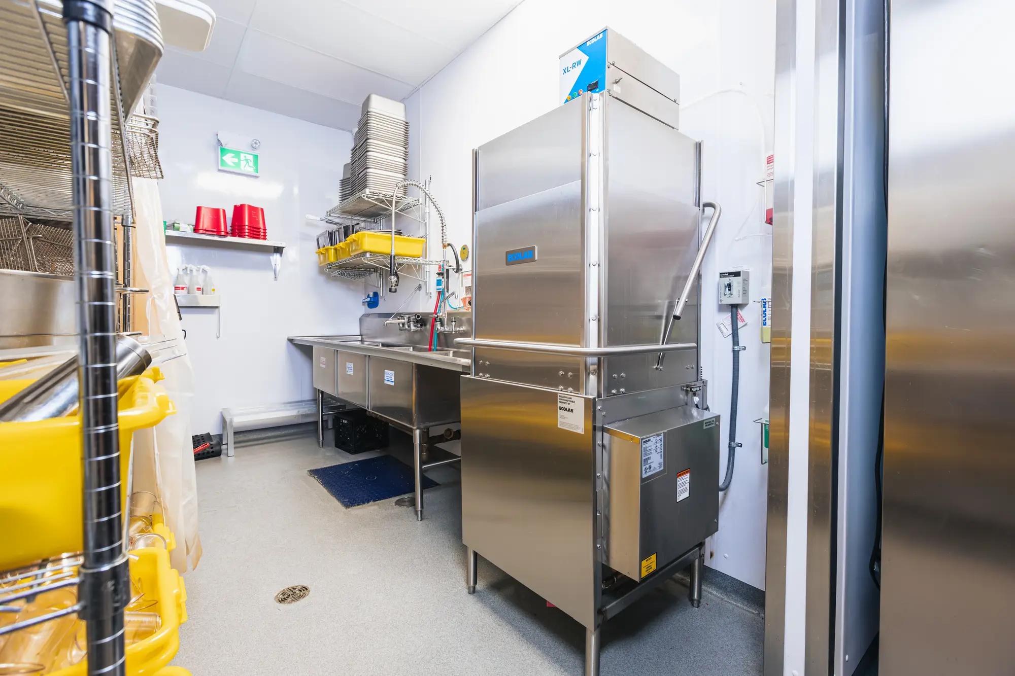 Warewash station with commercial dishwasher at Dave's Hot Chicken Pickering