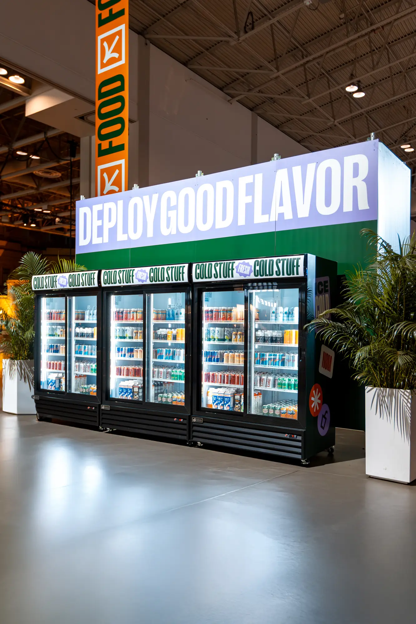 Branded glass-door cooler wall stocked for the Shopify activation
