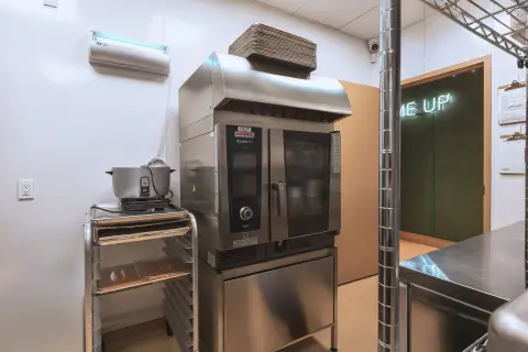 Combi oven on a stainless stand in the Farmhouse kitchen