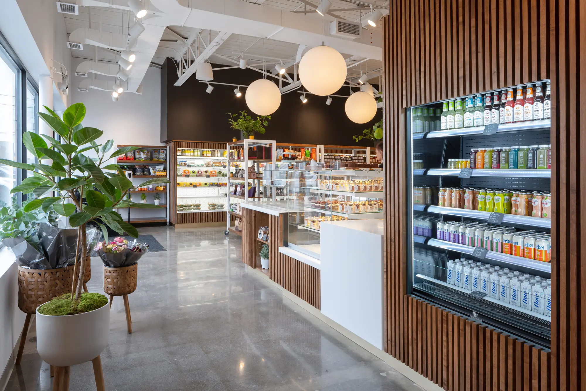 Freebird Market interior with open cases and slatted walnut