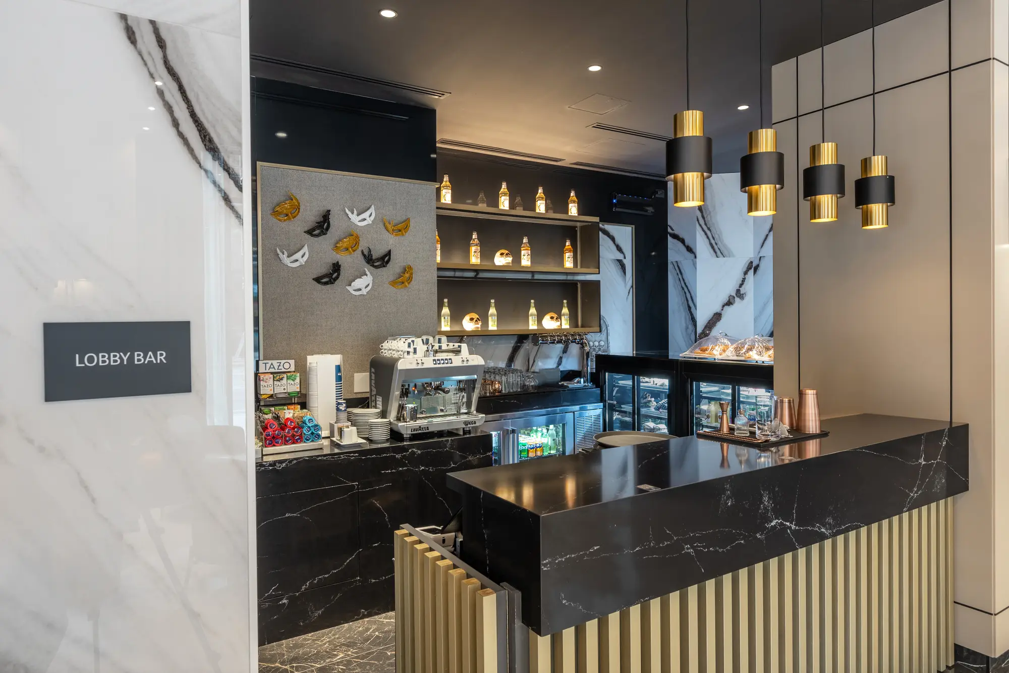 lobby bar with marble counter at Hotel Riu Plaza Toronto