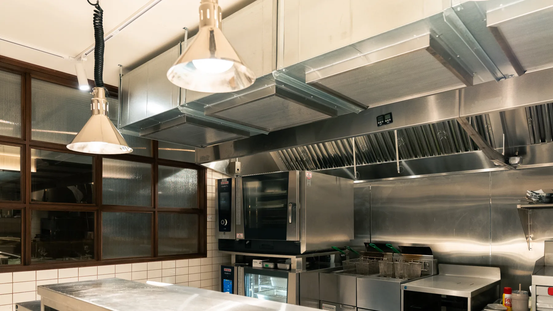 Linny's commercial cook line with ventilation and stainless equipment