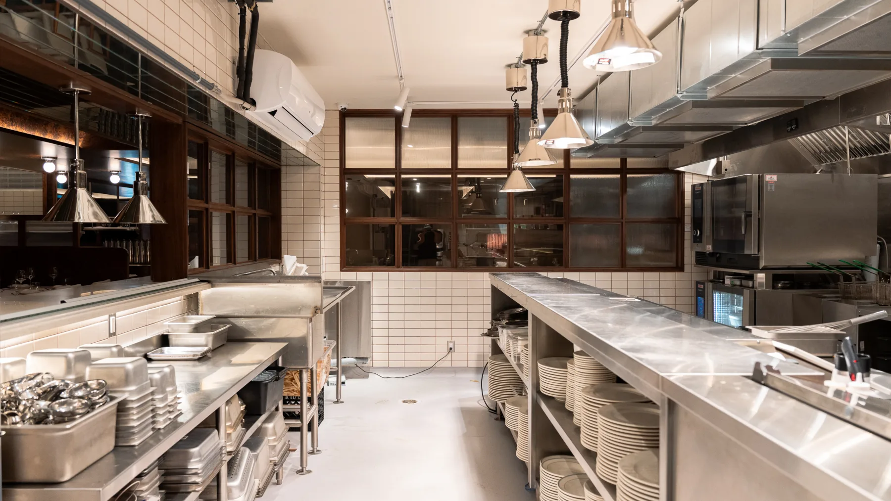 Linny's commercial kitchen with stainless pass and equipment line
