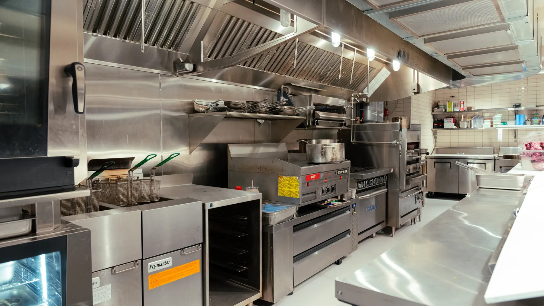 Wide view of Linny's stainless commercial kitchen