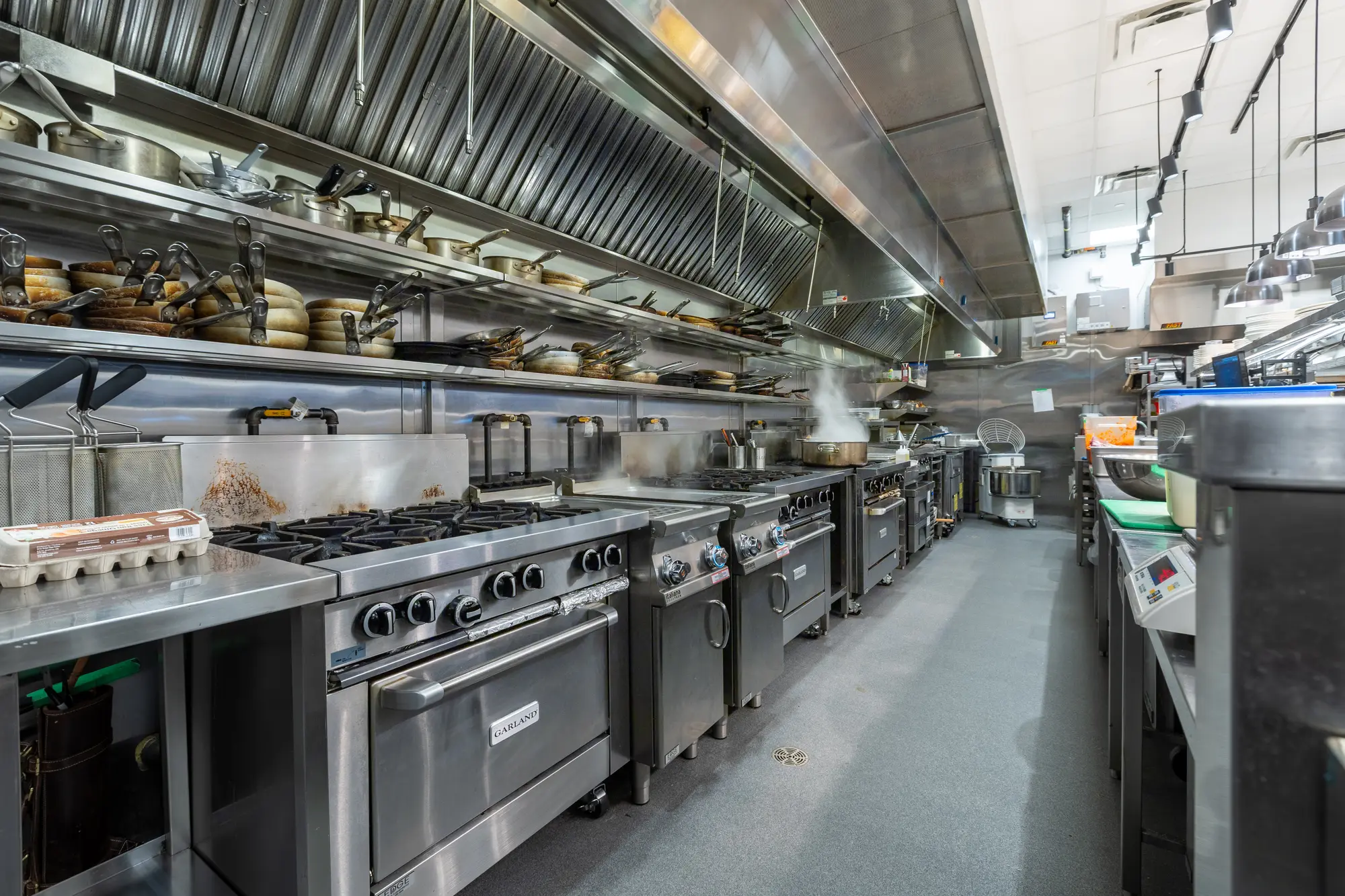 Commercial cooking line and ventilation canopy at Mercatto Centrale