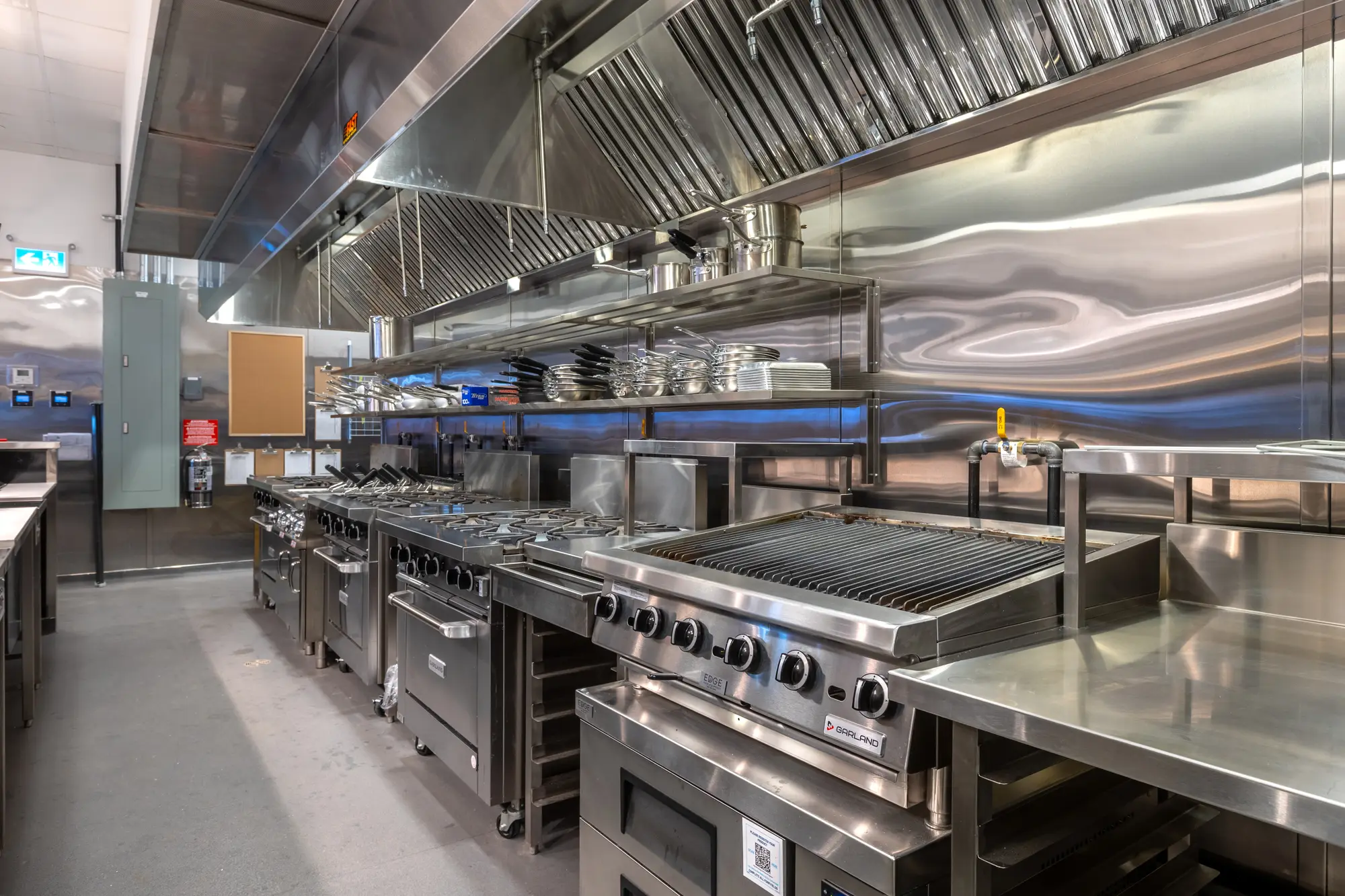 Stainless counters and undercounter refrigeration along the Mercatto Centrale cook line