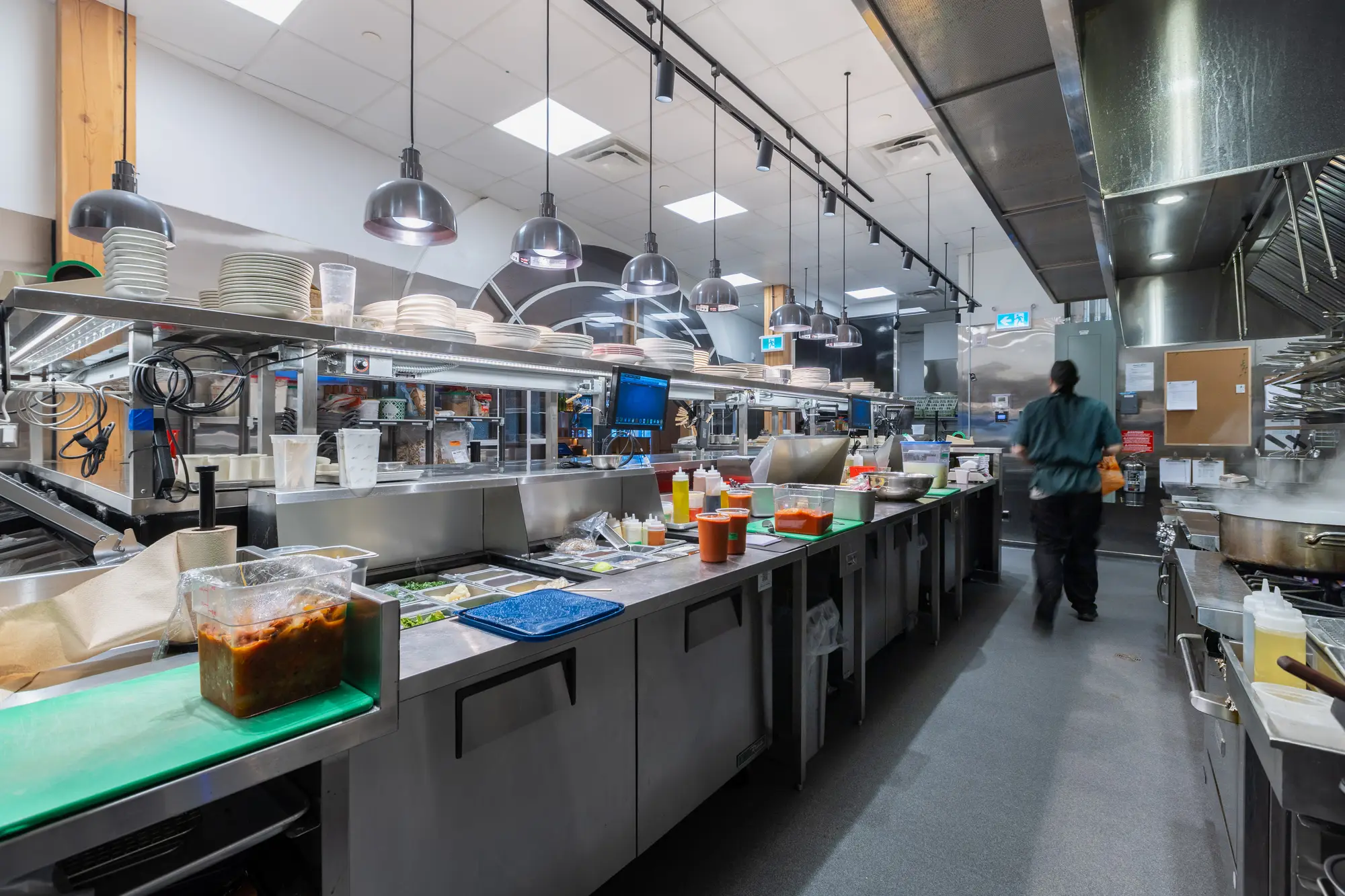 Kitchen staff working the prep line at Mercatto Centrale