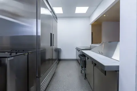 Reach-in refrigeration and worktable in the Petros82 kitchen