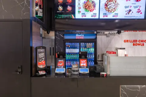 Ordering point with beverage coolers and menu screens