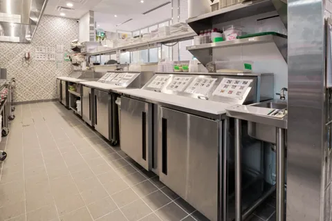 Pür & Simple Aurora: Cooking equipment and undercounter storage beneath the hood.