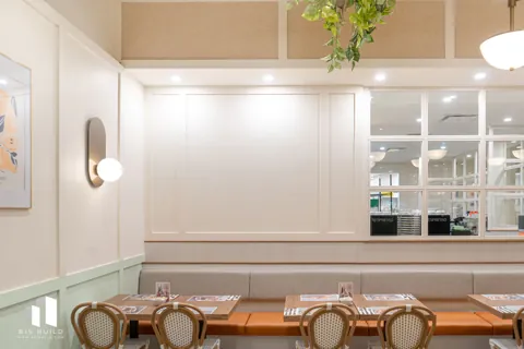 Pür & Simple Sherwood Park: Dining room with banquette seating and globe lights.