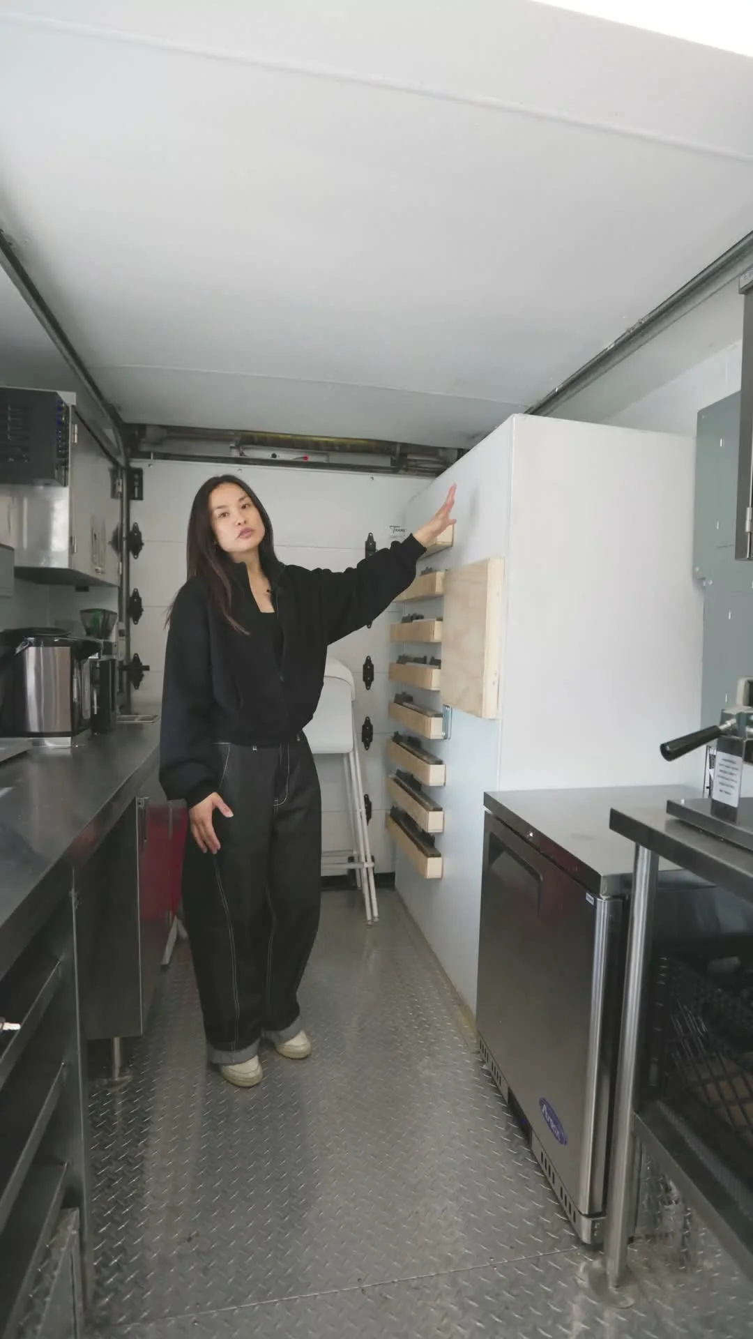 Inside the finished Ruru Baked truck: stainless prep line, under-counter refrigeration, and custom shelving built by The Cesario Group