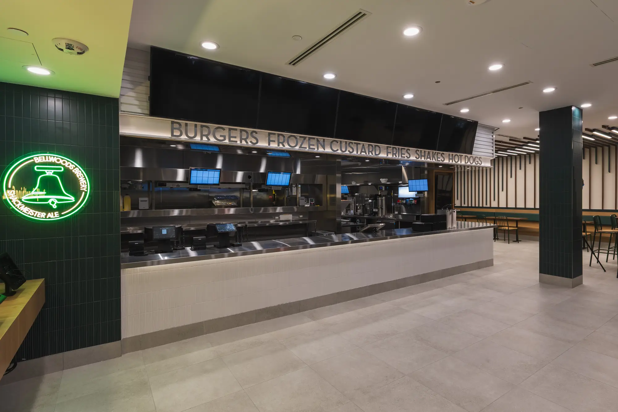 Finished order counter and menu boards at Shake Shack Square One