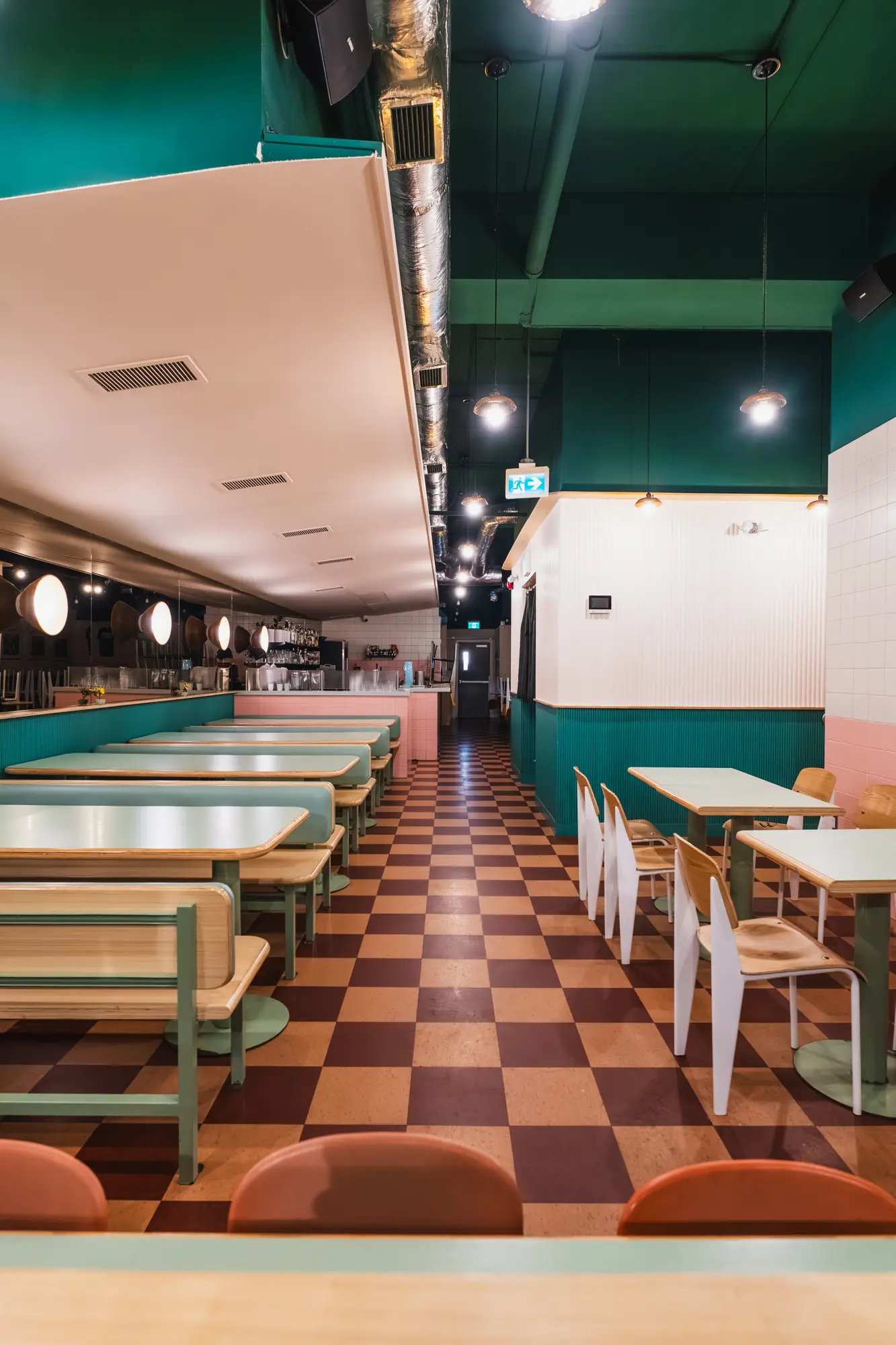 dining room with teal booths and checkered floor