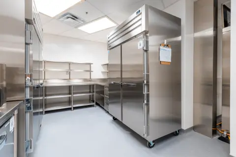 Reach-in refrigeration and shelving in the cold storage area